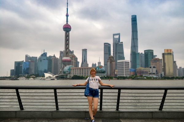 Blogger Alice standing in front of Shanghai City buildings skyscrapers