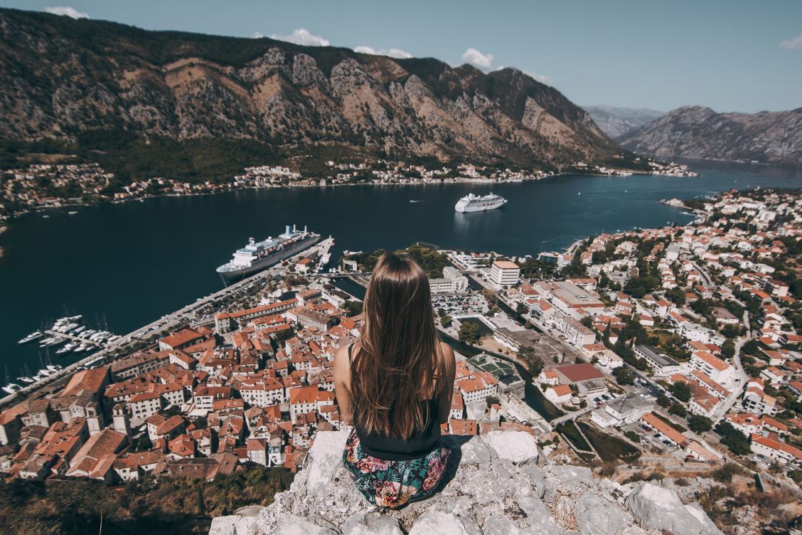 Solo female looking out upon Kotor Montenegro