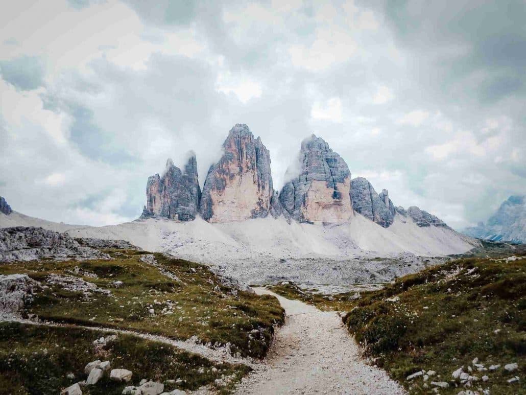 Stunning view of the mountains along the Tre Cime Natural Park Trek with a lots of fluffy clouds