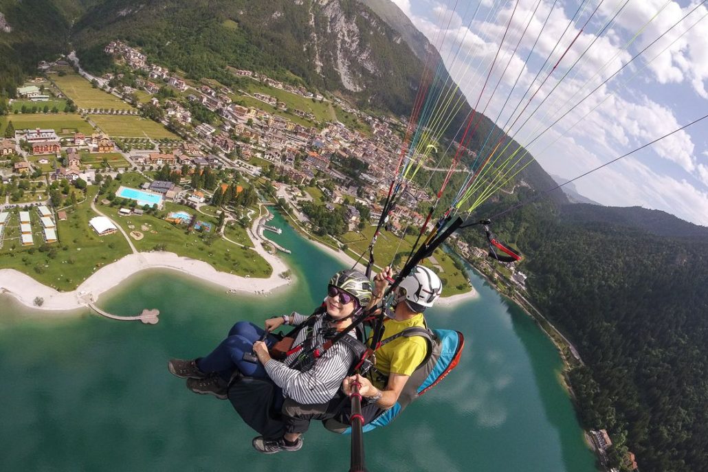 Alice Teacake paragliding with her instructor Stefano above Lake Molveno