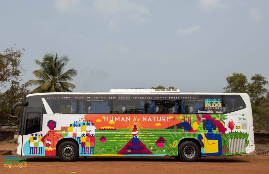 The Kerala Blog Express Bus which is green and orange in color.