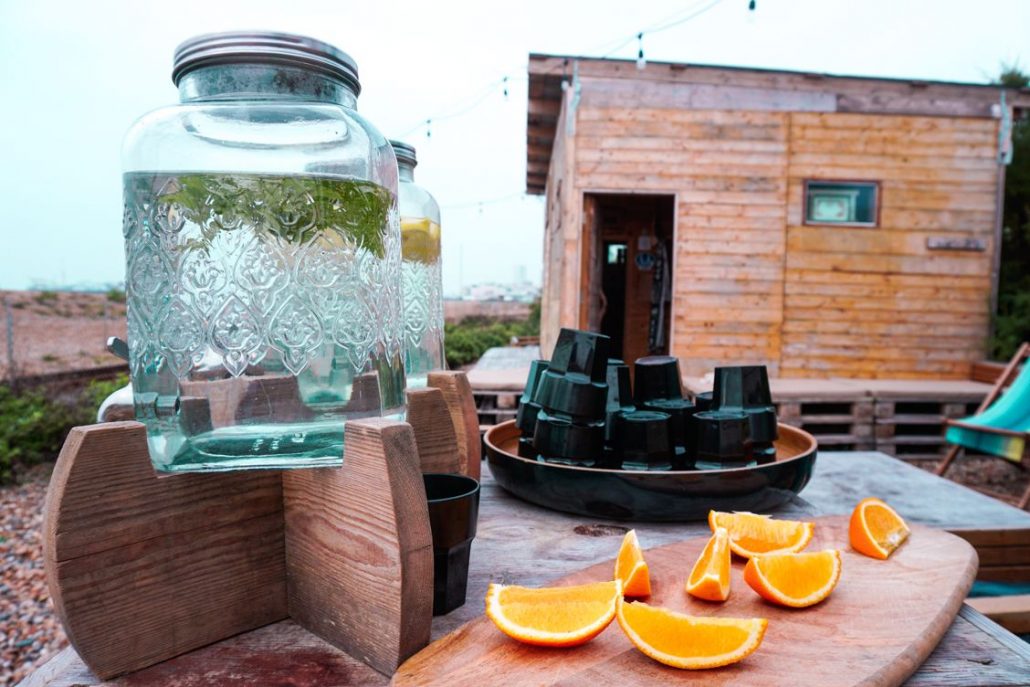 Cool mint water and oranges outside Beach Box Spa horseboxes on the beach