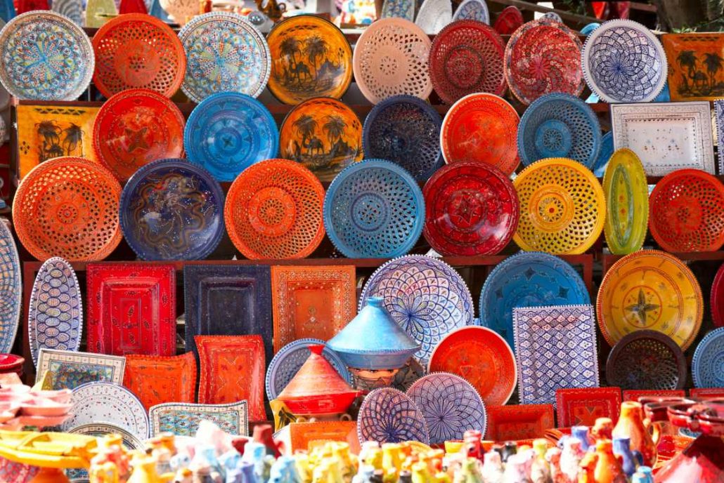 Colourful earthenware along the side of a street