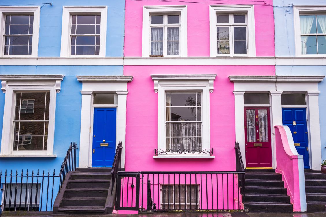Pink and blue traditional colorful houses and stairs at Notting Hill district, near Portobello road in London, UK